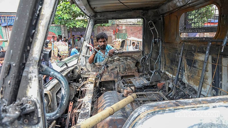 Hawkers set fire to several Dhaka North City Corporation vehicles during a drive to clear illegal structures from the Mirpur-10 footpath on Wednesday, Sept 30, 2026.