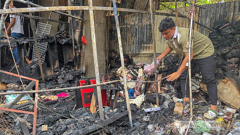 A temporary shop damaged by a fire sparked by an electrical short circuit during the footpath eviction drive at Dhaka’s Mirpur-10.