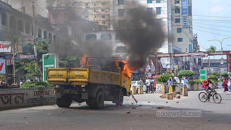 Hawkers set fire to several Dhaka North City Corporation vehicles during a drive to clear illegal structures from the Mirpur-10 footpath on Wednesday, Sept 30, 2026.