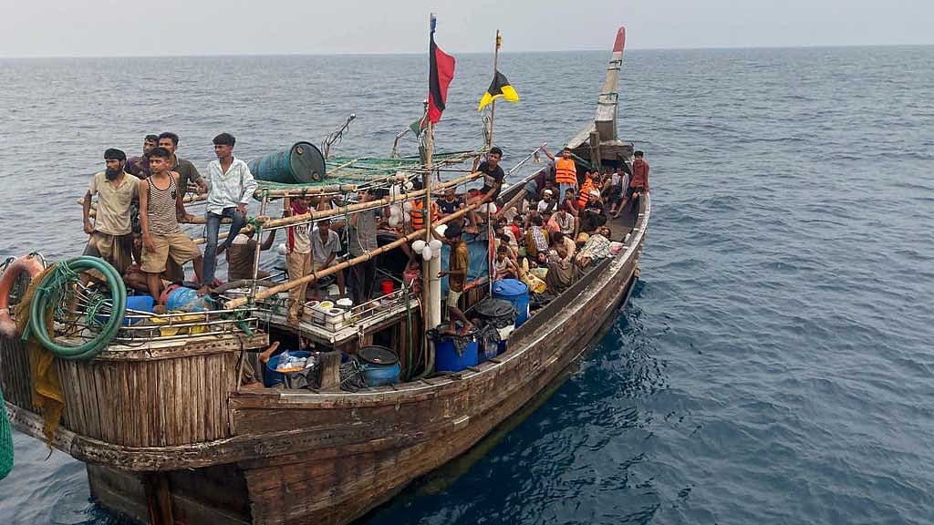 Navy rescues 65 'Malaysia-bound' people from deep sea, detains 11 'traffickers'