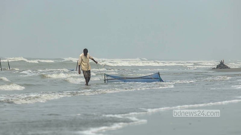 A fisherman pulls a net through the sea in Cox’s Bazar to collect bagda shrimp fry. Photo: Shamsul Haque Ripon