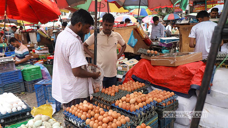 A customer buys eggs at Dhaka’s Karwan Bazar. Photo: Shamsul Haque Ripon