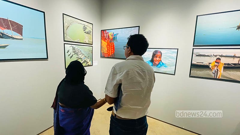 Visitors view river photographs by photographer Abir Abdullah at the National Museum on Saturday, Oct 3, 2026. Photo: Shamsul Haque Ripon