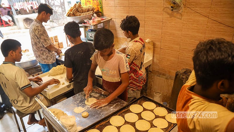 Bakarkhani makers work through the day at a shop on Nazimuddin Road in Old Dhaka. Photo: Shamsul Haque Ripon
