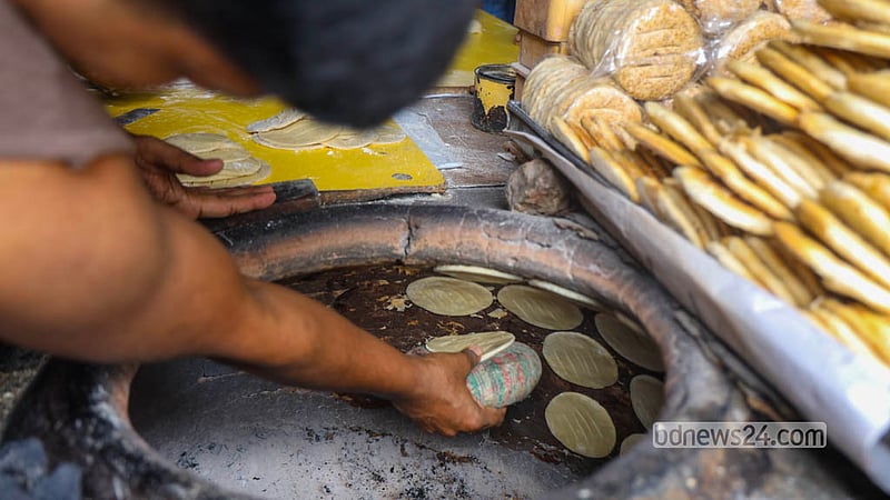 Bakarkhani makers work through the day at a shop on Nazimuddin Road in Old Dhaka. Photo: Shamsul Haque Ripon