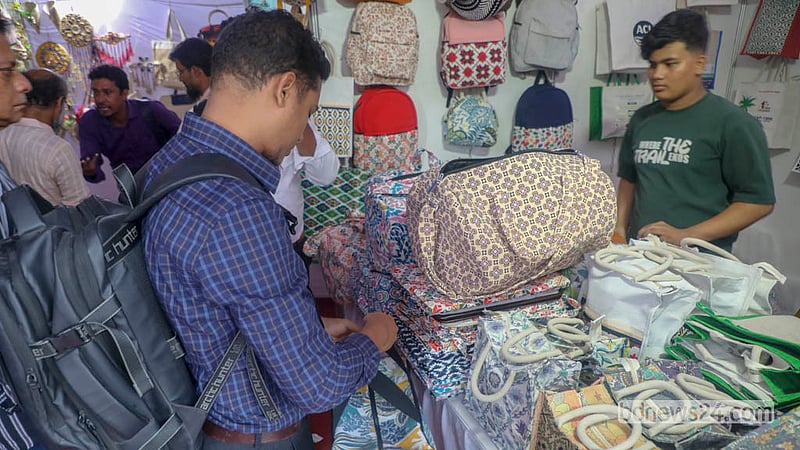 Visitors of different ages browse the wide range of jute products on display at the fair in Tejgaon.  Photo: Abdullah Al Momin