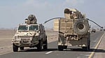 Yemeni govt fighters shown driving vehicles over Houthis