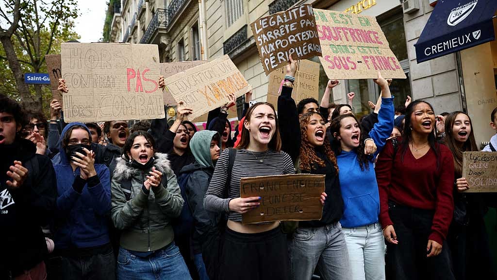 France halts police use of stun grenades after teenager loses hand as school protests continue