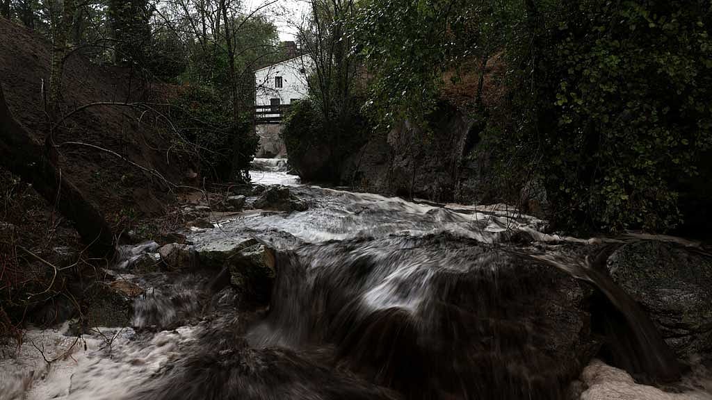 Wildfire ash turns Spanish mountain river black, contaminating water supply