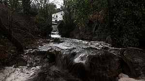 Spanish mountain river runs black after wildfire