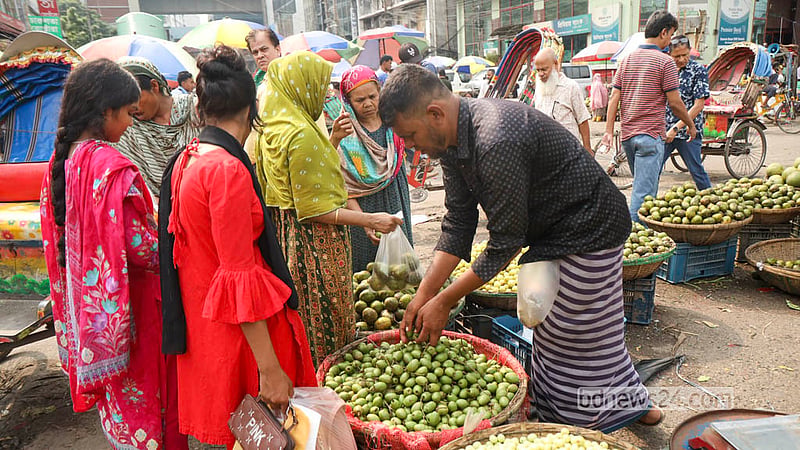 Shoppers crowd a stall for fresh olives at Dhaka’s Karwan Bazar. Photo: Shamsul Haque Ripon