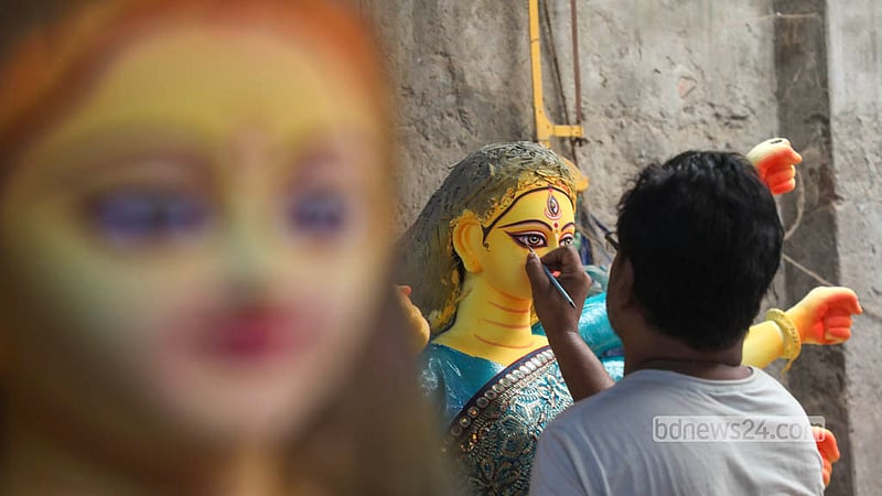 With the festival drawing closer, idol makers at the Zamindar Bari Puja Mandap are working around the clock to finish their creations. Photo: Shamsul Haque Ripon