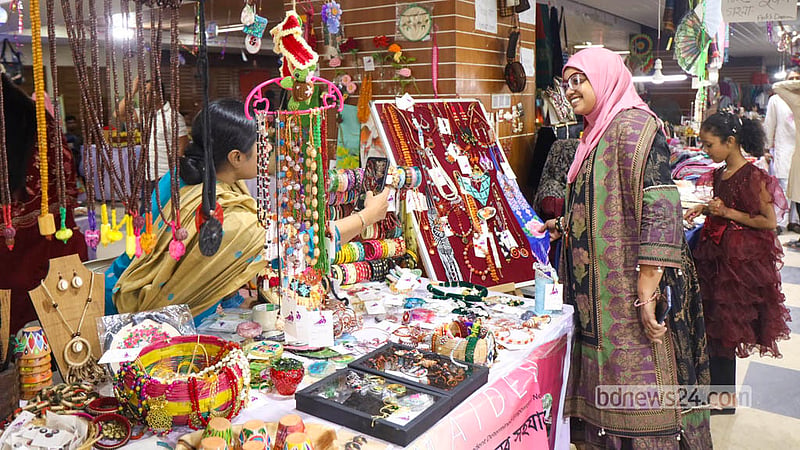 Handmade jewellery items made by women entrepreneurs taking part in the Autumn Fair attract the attention of buyers. Photo: Shamsul Haque Ripon