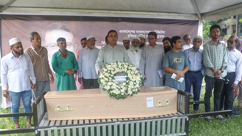 Brig Gen Mohammad Raisul Islam, assistant military secretary, lays a floral tribute on behalf of President Mirza Fakhrul Islam Alamgir to Toufique Imrose Khalidi, a pioneer of digital journalism in Bangladesh.