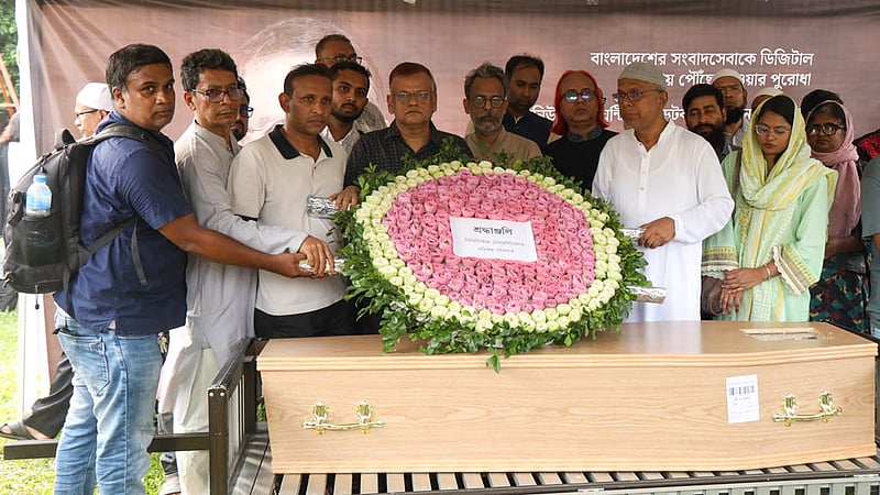 The coffin of Toufique Imrose Khalidi, the late editor-in-chief and publisher of bdnews24.com, rests at Banani’s Old DOHS playground, where friends, family, colleagues and well-wishers gather to honour his life and bid him farewell.