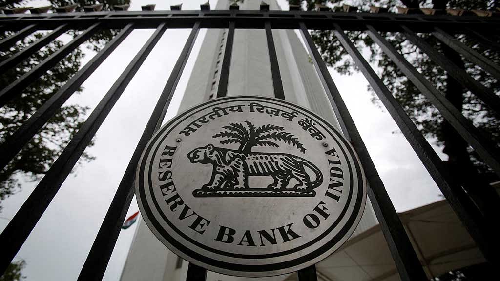 India unveils tough curbs on dollar demand to defend rupee