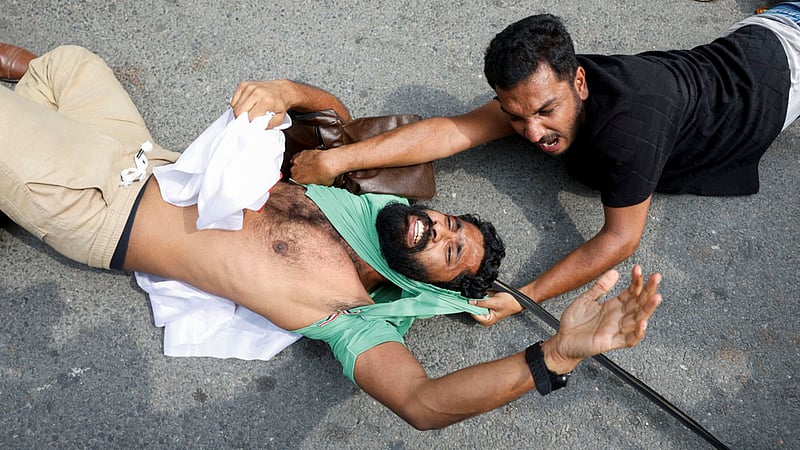 Protesters react as they are detained by security personnel during a protest by the Cockroach Janta Party (CJP) seeking the resignation of India's Chief Election Commissioner Gyanesh Kumar, near the protest site in New Delhi, India, October 11, 2026. Photo: Reuters