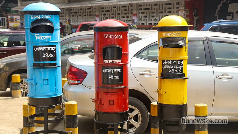 Replicas of red letter boxes in different sizes are on display at the Letter Festival and Postage Stamp Exhibition, highlighting a familiar symbol of traditional postal communication on Monday, Oct 12, 2026. Photo: Shamsul Haque Ripon