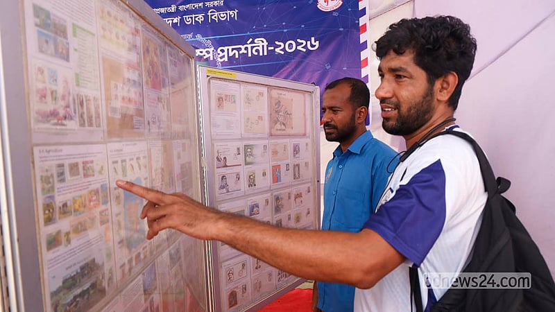 Visitors browse rare and historic postage stamps arranged on display boards at the exhibition at Dhaka University’s TSC on Monday, Oct 12, 2026, marking World Post Day. Photo: Shamsul Haque Ripon