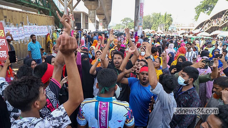 Workers from several garment factories protest by blocking a highway in Dhaka’s Uttara on Wednesday, Oct 14, 2026. Photo: Shamsul Haque Ripon