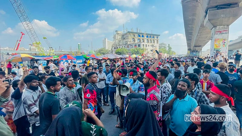 Workers from several garment factories protest by blocking a highway in Dhaka’s Uttara on Wednesday, Oct 14, 2026. Photo: Shamsul Haque Ripon