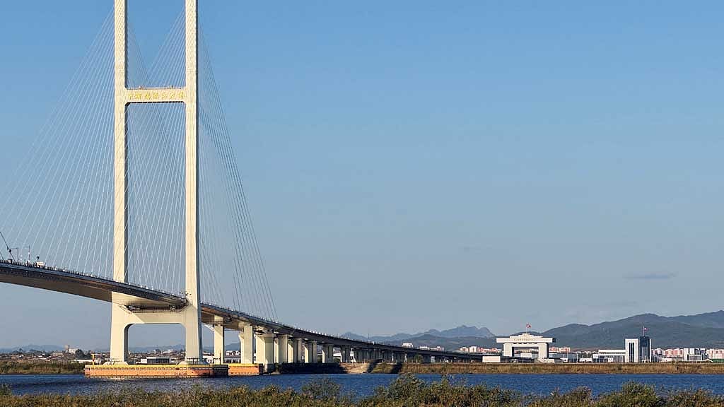 Trucks line up as long-delayed China-North Korea bridge officially opens