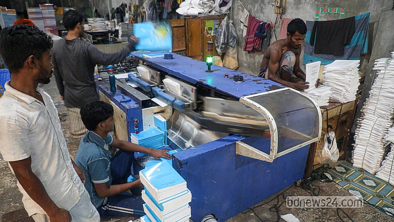 Workers are busy printing textbooks at a printing press in Dhaka’s Matuail. Photo: Abdullah Al Momin