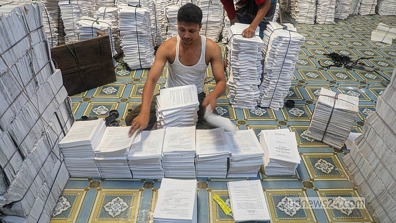 With the new year fast approaching, workers press on with the task of producing textbooks, racing to ensure students receive their new books on the first day of the year. Photo: Abdullah Al Momin
