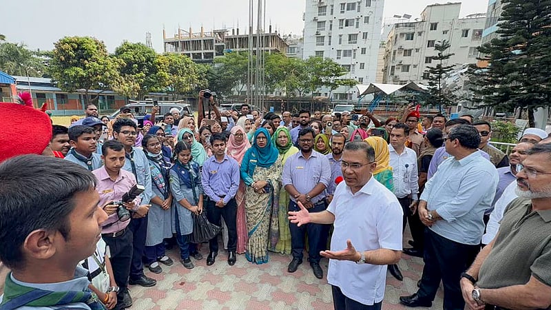 Prime Minister Tarique Rahman speaks with teachers and students during a visit to Mirpur Cantonment Public School and College in Dhaka on Saturday, Oct 17, 2026. Photo: PMO