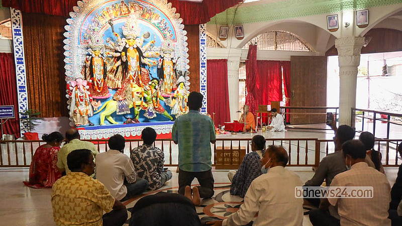 Hindu devotees offer prayers at the feet of Goddess Durga after the installation of the Nabapatrika at the Puja Mandap of the Ramakrishna Mission and Math in Dhaka on Saturday, Oct 17, 2026. Photo: Shamsul Haque Ripon