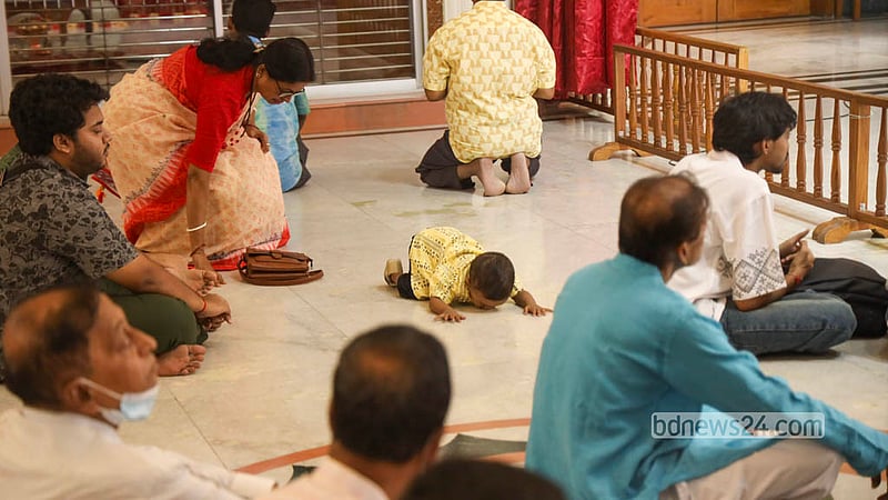 Hindu devotees offer prayers at the feet of Goddess Durga after the installation of the Nabapatrika at the Puja Mandap of the Ramakrishna Mission and Math in Dhaka on Saturday, Oct 17, 2026. Photo: Shamsul Haque Ripon