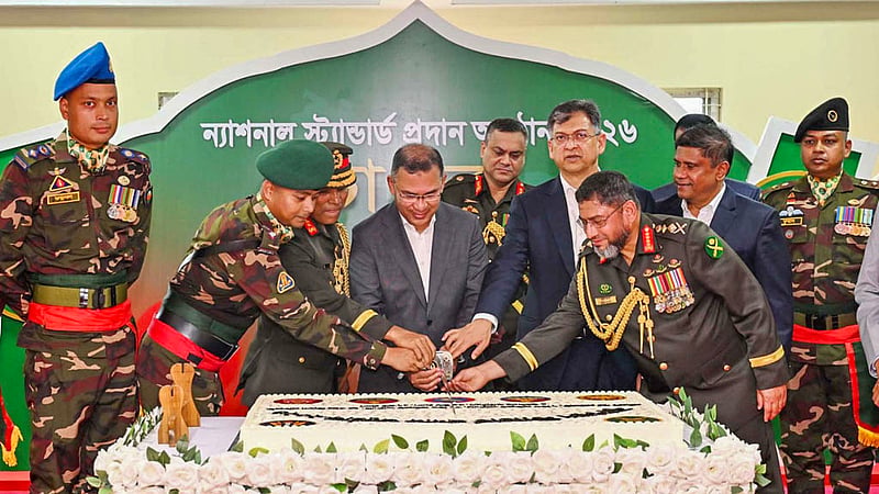 Prime Minister Tarique Rahman cuts a cake at the National Standard presentation ceremony at Savar Cantonment on Sunday, Oct 18, 2026. Photo: PID