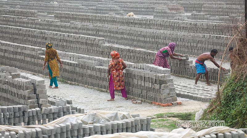 Workers get busy at a brick kiln at Keraniganj’s Zazira.  Photo: Abdullah Al Momin