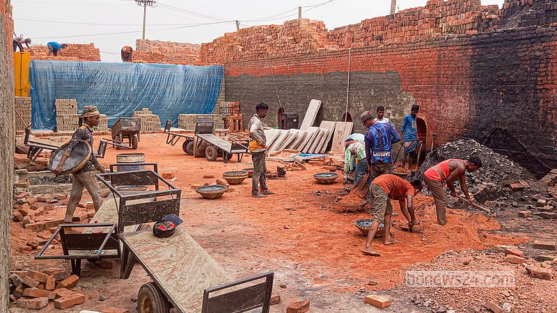 Workers get busy at a brick kiln at Keraniganj’s Zazira.  Photo: Abdullah Al Momin