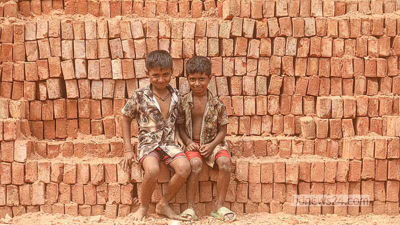 Brothers Imam and Hasan spend time at the kiln where their parents work. The family came from Gaibandha to earn a living at a brick kiln at Keraniganj’s Zazira.  Photo: Abdullah Al Momin
