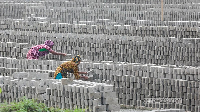 Women work alongside men at a brick kiln at Keraniganj’s Zazira.   Photo: Abdullah Al Momin