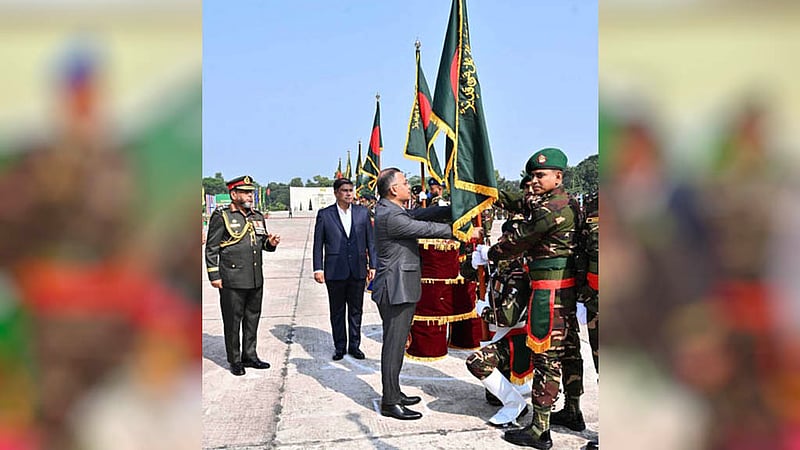 Prime Minister Tarique Rahman presents National Standards to several army regiments and battalions at Savar Cantonment on Sunday, Oct 18, 2026. Photo: PID