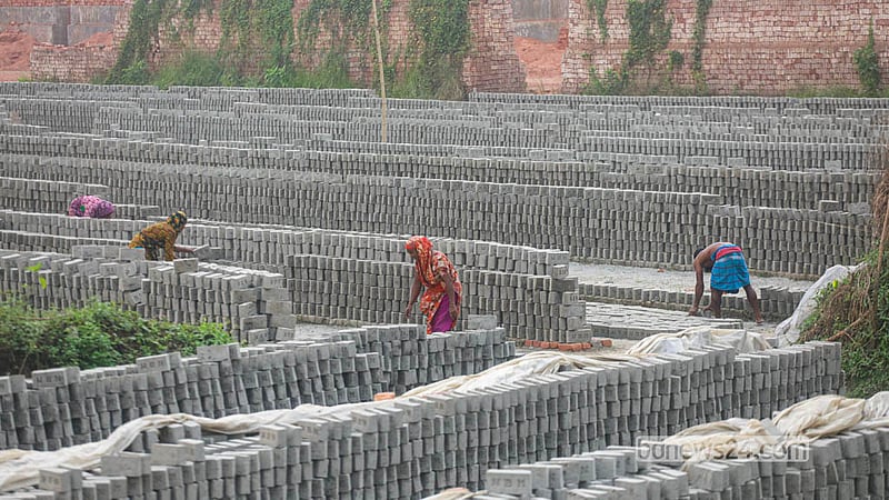Workers get busy at a brick kiln at Keraniganj’s Zazira.  Photo: Abdullah Al Momin