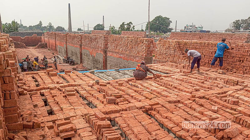 Women work alongside men at a brick kiln at Keraniganj’s Zazira.   Photo: Abdullah Al Momin