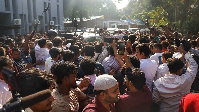 Dhaka-6 MP Ishraque Hossain is surrounded by hundreds of party leaders and activists as he leaves the National Press Club after announcing his resignation on Monday, Oct 19, 2026. Photo: Shamsul Haque Ripon
