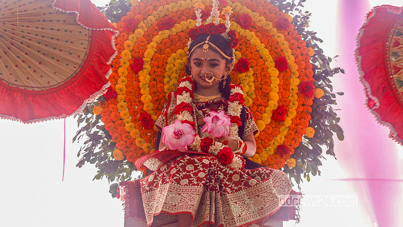 A young girl sits on the ceremonial seat of the goddess during Kumari Puja at Ramakrishna Mission in Dhaka on Monday, Oct 19, 2026 on Ashtami. Photo: Shamsul Haque Ripon