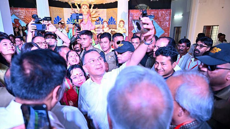 Prime Minister Tarique Rahman takes selfies with devotees while visiting the Dharmasabha Puja Pavilion at Radha Govinda Temple in Rangpur on Tuesday, Oct 20, 2026 -- the ninth day of Durga Puja, Nabami. Photo: PMO