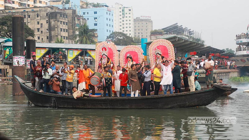 Devotees bid farewell to Goddess Durga as her idols are immersed in the Buriganga River at Wais Ghat in Dhaka. Photo: Abdullah Al Momin