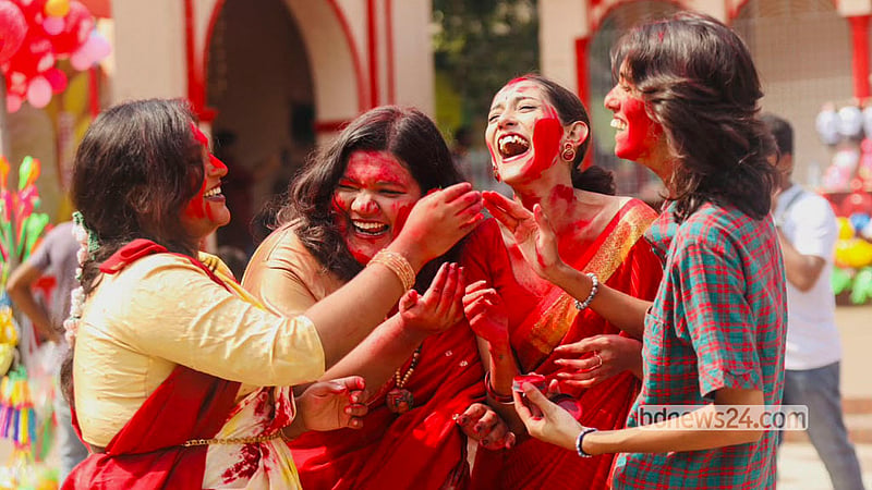 Married women smear vermilion on one another in the "Sindoor Khela" and play with coloured powder as drums, conch shells and ululation fill the Puja pavilion at Dhakeshwari National Temple before Goddess Durga is bid farewell on Bijoya Dashami. Photo: Shamsul Haque Ripon