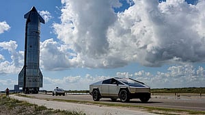 Tesla cuts spending before potential SpaceX deal