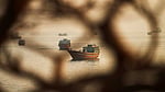 Iran reports 7 vessels hit, warns US