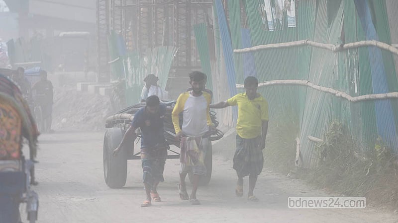Going without a face mask on the Babubazar-Gabtoli embankment road has become hard as heavy dust builds up, peaking in the dry season. Photo: Abdullah Al Momin