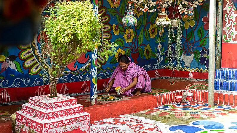 Dekhon Barman has maintained the designs on the house for years with immense love and patience during her various daily household chores. Photo: Shamsul Haque Ripon