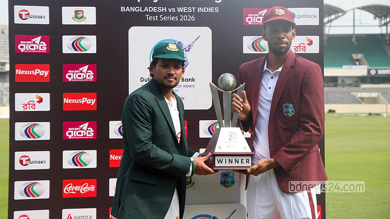 Najmul Hossain Shanto and Kraigg Brathwaite hold the official trophy of the two-match Test series between Bangladesh and West Indies. Photo: Shamsul Haque Ripon