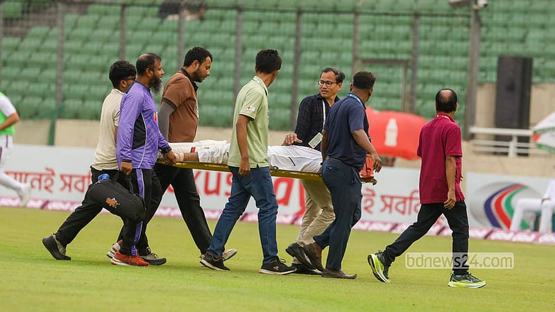 Bangladesh middle-order batter Towhid Hridoy is carried off the field on a stretcher after suffering a muscle cramp while batting on the opening day of the first Test against West Indies in Mirpur. Photo: Shamsul Haque Ripon